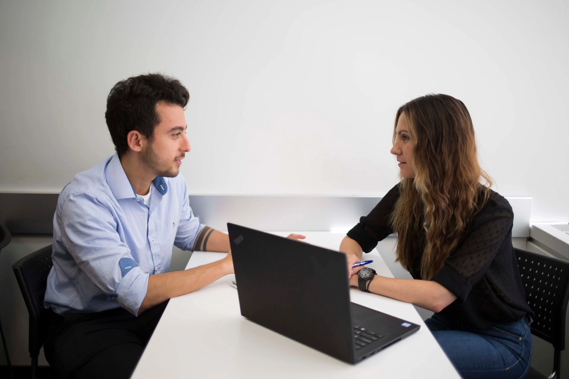 International student from ILAC International College consulting with an instructor in a classroom